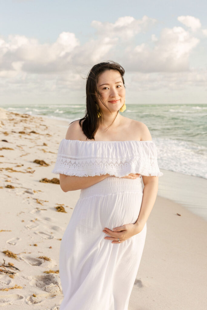 Pregnant mother during a Miami beach maternity photography session at sunrise.