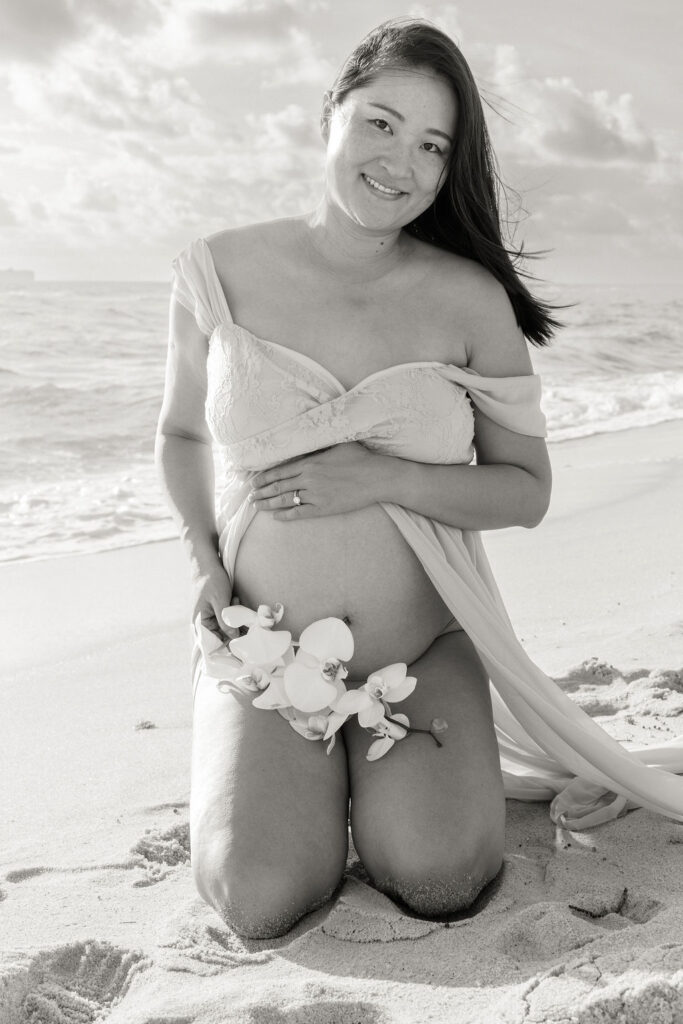 Artistic black and white maternity portrait on the beach in Miami.