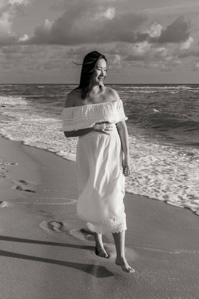 Black and white maternity beach portrait during sunrise in Miami.
