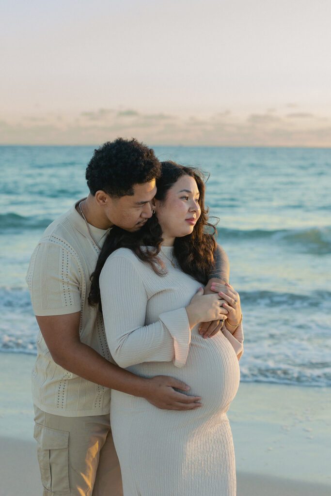 Romantic maternity photography portrait of expecting couple in South Florida.