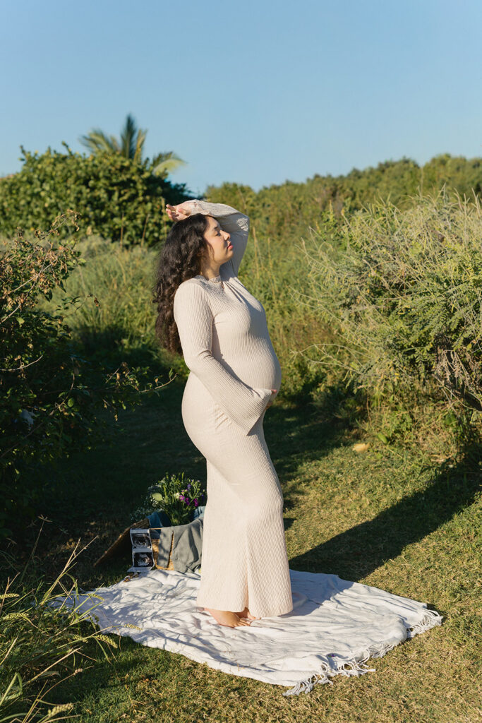 Outdoor editorial maternity photography portrait in South Florida nature preserve.