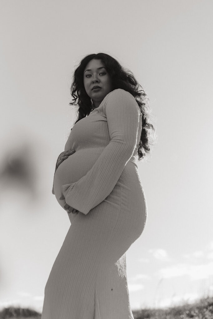 Artistic South Florida maternity photography portrait with expecting mother at sunrise.